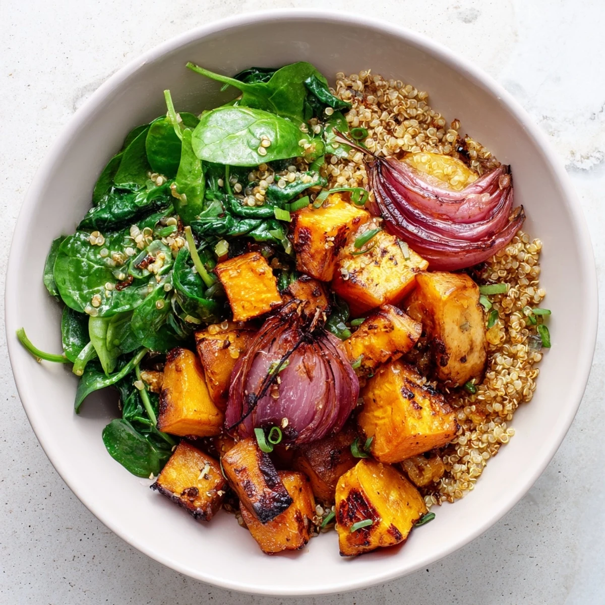 Golden roasted Warm Herb Bowl featuring a medley of hearty vegetables; thyme and tarragon enhance.