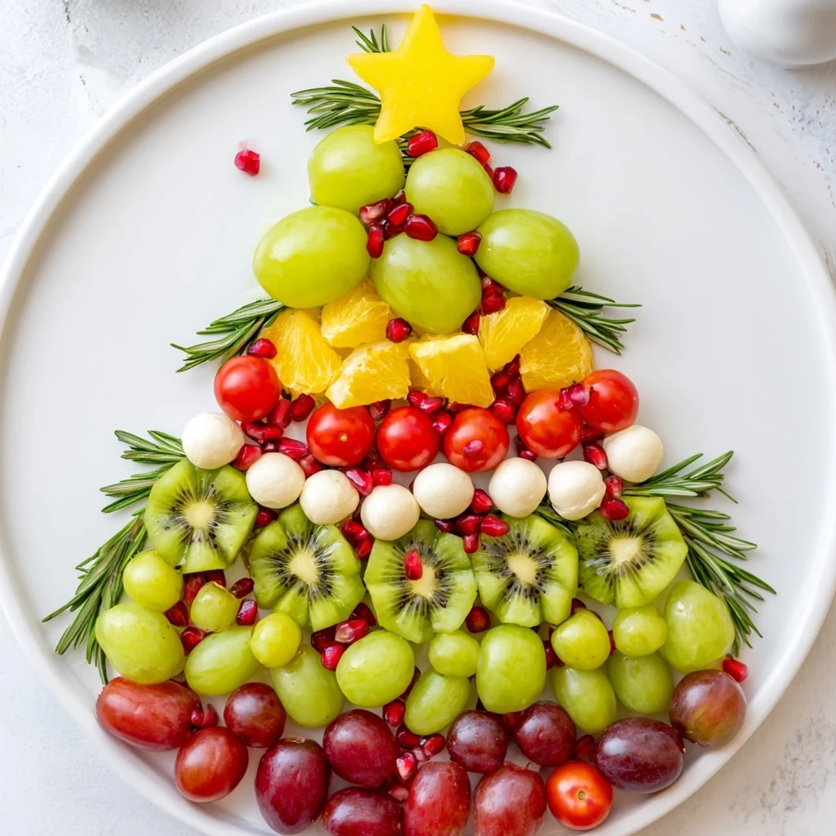 A delightful view of this Christmas Tree Triangle Board, featuring vibrant olives and grape "ornaments".
