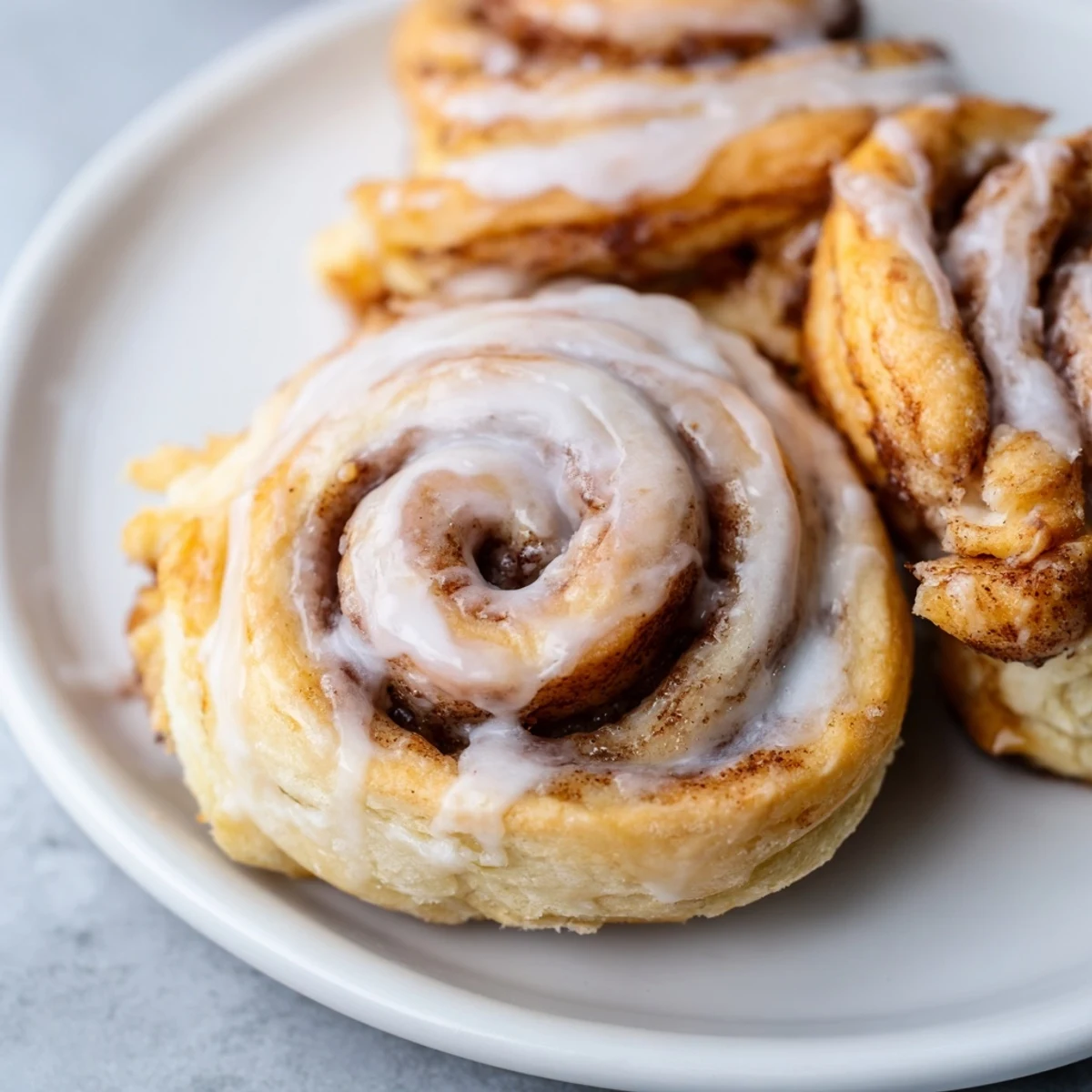 Golden, flaky Air-Fryer Cinnamon Roll Twists swirled with cinnamon, perfect for a quick breakfast.