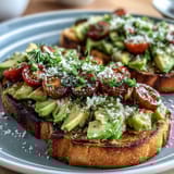 1. Spring Brunch Avocado Toast Board with Smoked Salmon, featuring creamy avocado, smoked salmon, and fresh vegetables on rustic sourdough bread.