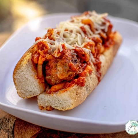 Meatball Marinara Sub sandwiches oozing melted mozzarella and Parmesan, a comforting Italian-American classic.