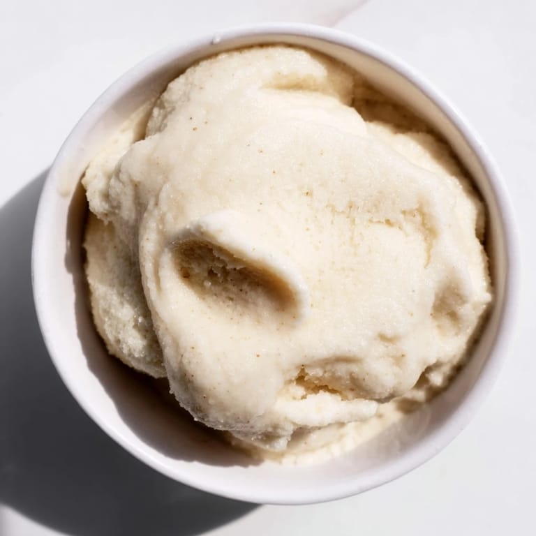 A close-up of delicious 2-Ingredient Banana Ice Cream, ready to be scooped and devoured.