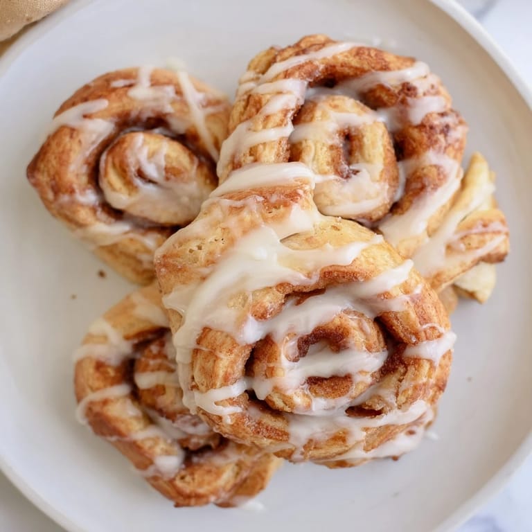 Get ready for delightfully crispy Air-Fryer Cinnamon Roll Twists with a perfect cinnamon sugar filling.