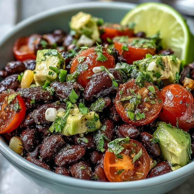 Colorful Black Bean and Veggie Bowl topped with cilantro and pumpkin seeds, perfect for a healthy lunch.
