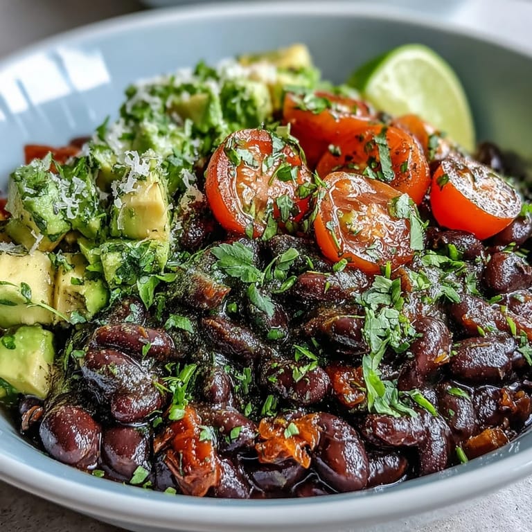 Vibrant Black Bean and Veggie Bowl with corn, beans, and lime dressing in a bright kitchen setting.